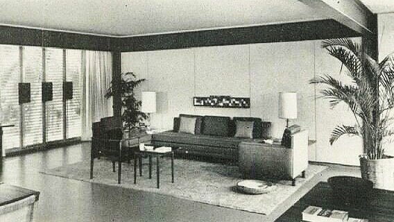 The Biggs living room, in which some segments of the house’s structural steel can be seen—especially the pair of long beams which span the living space.