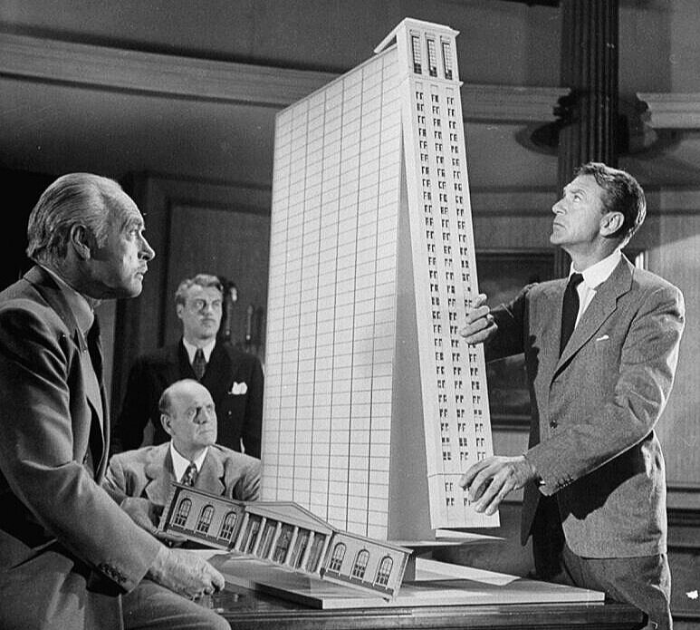 Ayn Rand’s architect hero, Howard Roark (at right) at a moment-of-truth: considering whether to compromise on the integrity of his design.