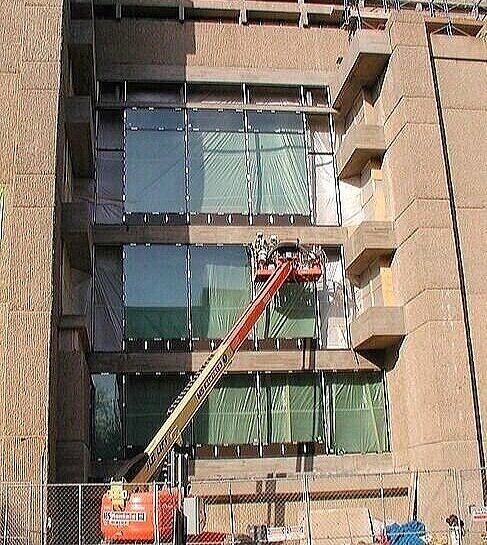 Windows—their form, details, and framing—are a part of every architects palette—and Paul Rudolph varied how they were handed in his design at Yale. Here they’re shown the process of replacement during the renovation.